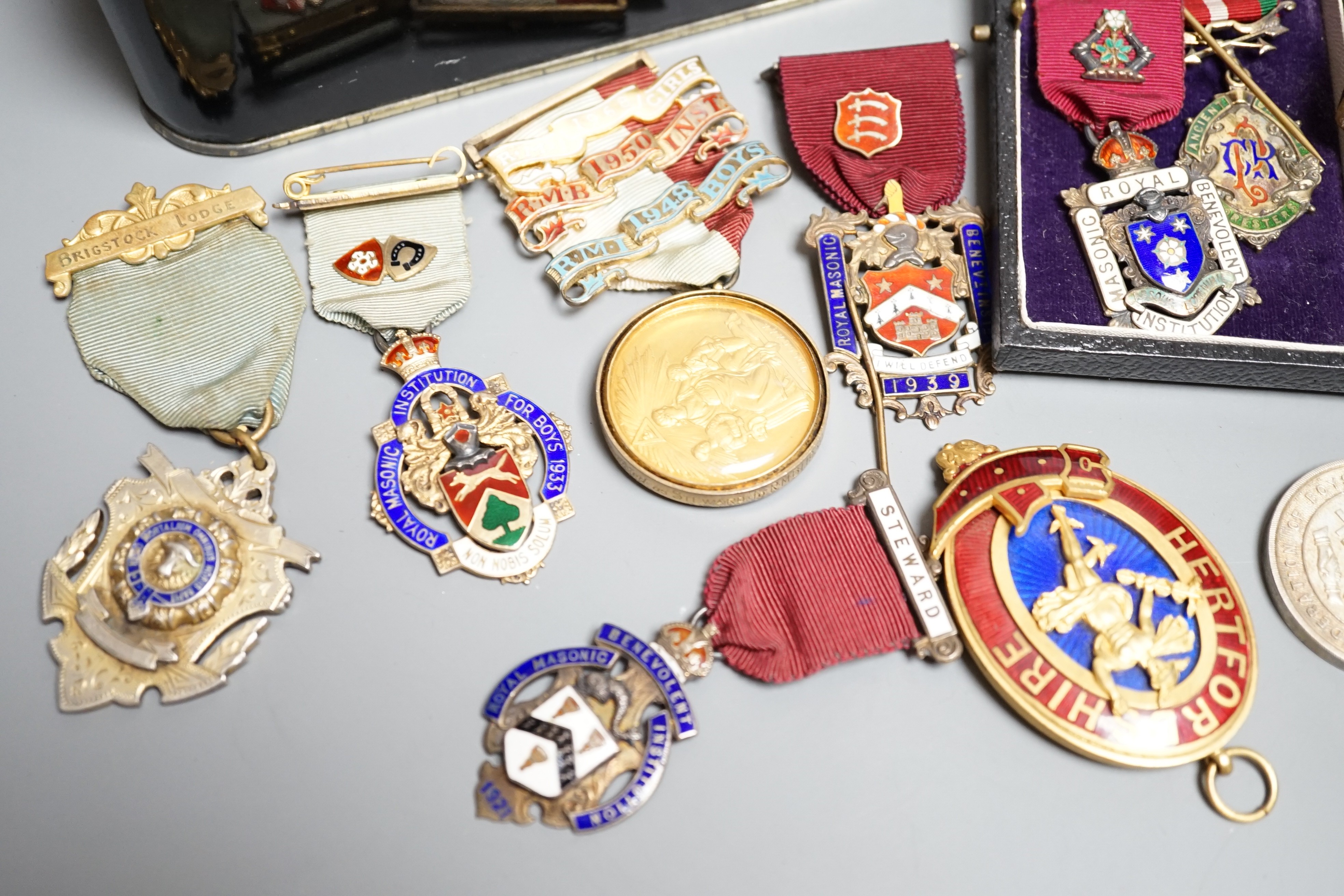 A collection of silver or gilt metal and enamel Masonic medals